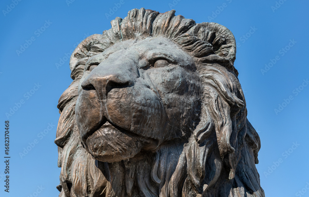 Fototapeta premium Large stone lion statue at Macedonia Square in central Skopje, North Macedonia
