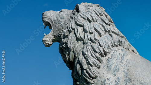 Large stone lion statue at Macedonia Square in central Skopje, North Macedonia