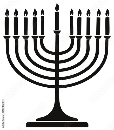 Nine branched menorah with nine lit candles a symbol of Hanukkah