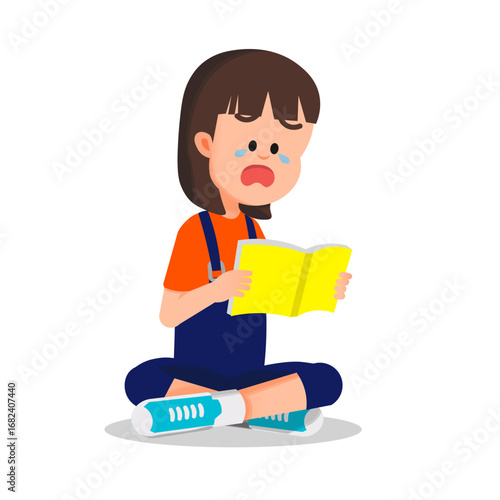 A little girl sits on the floor reading a book with a sad expression and tears in his eyes