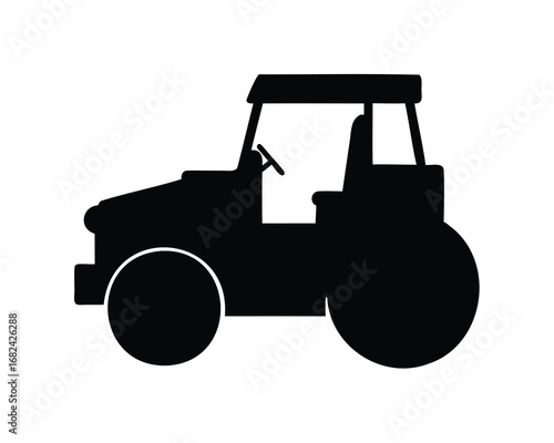 Silhouette of a vintage tractor with large tires and open cab design