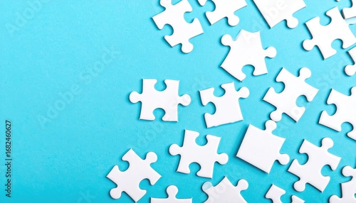 White puzzle pieces are scattered haphazardly on a light blue background, creating an incomplete mosaic of potential connections
