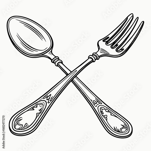 Ornate spoon and fork crossed on white cutlery utensil