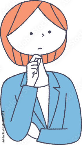 考え事をしているスーツを着た女性