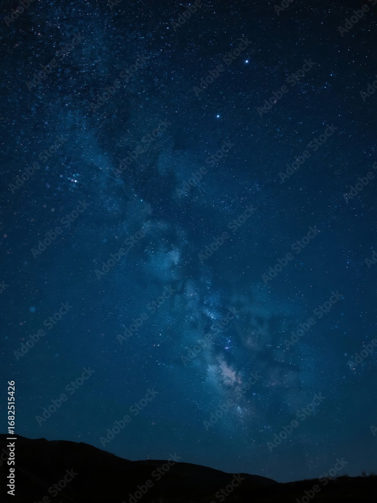 Fototapeta premium Starry Night Sky with the Milky Way Over Silhouetted Hills