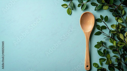 Flat lay eco-food background with simple wooden spoon on light pastel desk, clean empty space for text, organic diet, fresh ingredient and healthy vegetarian lifestyle design.