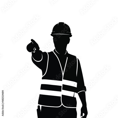 Silhouette of a construction worker in a hard hat and safety vest pointing