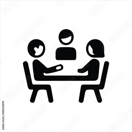 Three people sitting around a table in a meeting or discussion icon group
