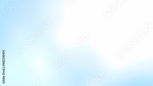 柔らかな光が広がるライトブルーの抽象背景