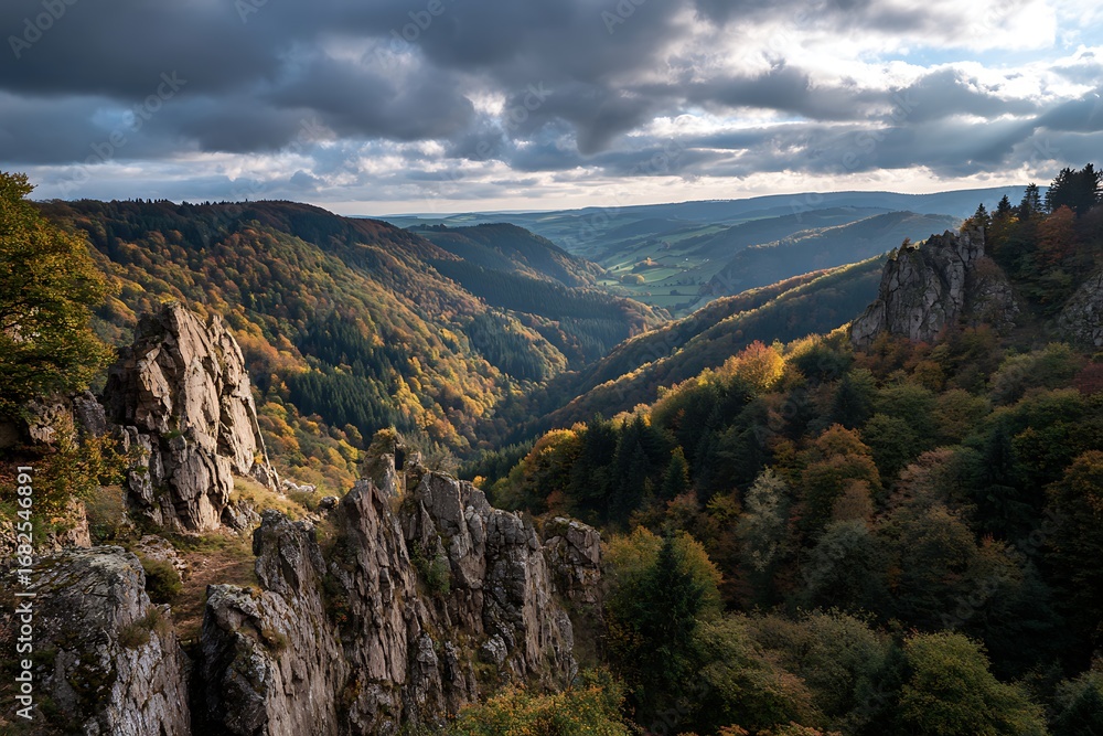 Obraz premium 1. Autumn cliffside with forests cascading down into valleys, dramatic sky above 