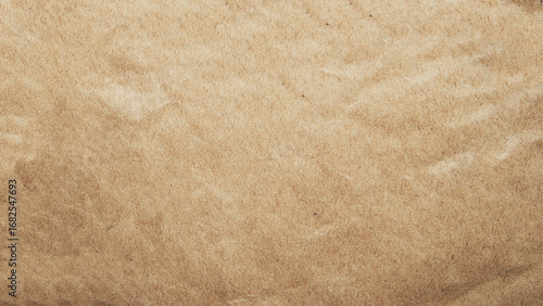Crumpled brown craft package paper texture. Abstract beige background with wrinkled cardboard texture. Vector illustration of a realistic origami page card folded and then unfolded sheet of paper