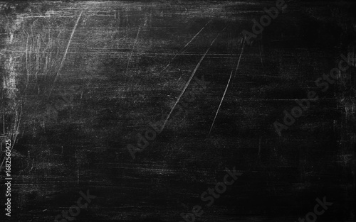 Old dark scratched metal texture grunge background. close up of a black dirty chalkboard