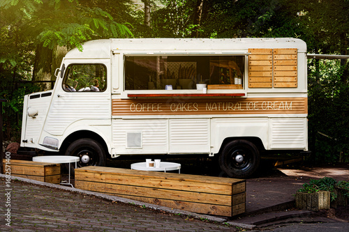 Street coffeeshop bus in the summer park	