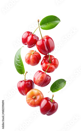 Fresh Acerola Cherries cascading down on a white background creates a dynamic composition