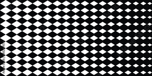 Seamless harlequin pattern with white diamonds on a black background. eps 10
