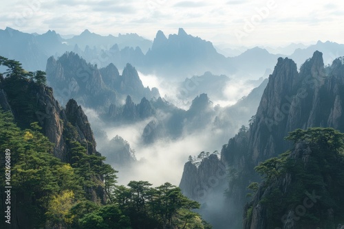 Layers of misty Chinese mountains at sunrise

