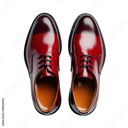 Elegant red dress shoes with polished finish from top view, isolated background 