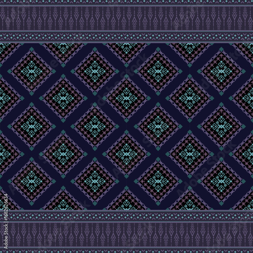 Native fabric pattern in shades of navy blue, purple, and blue-green. The main pattern in the center is a diamond pattern, layered and continuous in a long strip. It is decorated with small geometric 