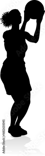 Silhouette of athletic woman female basketball player with basketball ball. Sports concept.