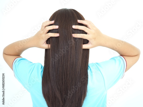 Young woman scratching on head from itching. 