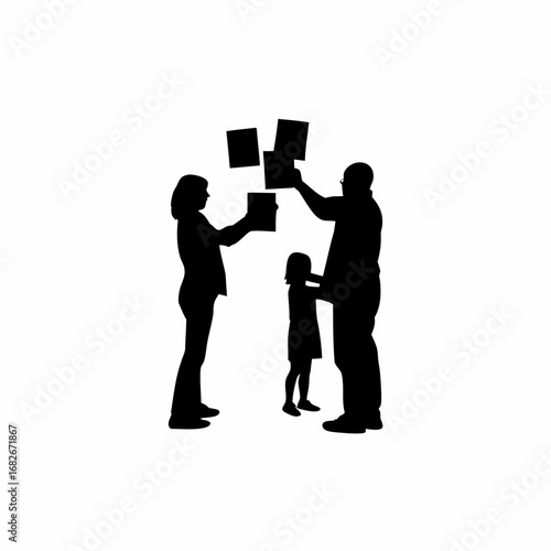 Silhouette of a family happily organizing photo albums together