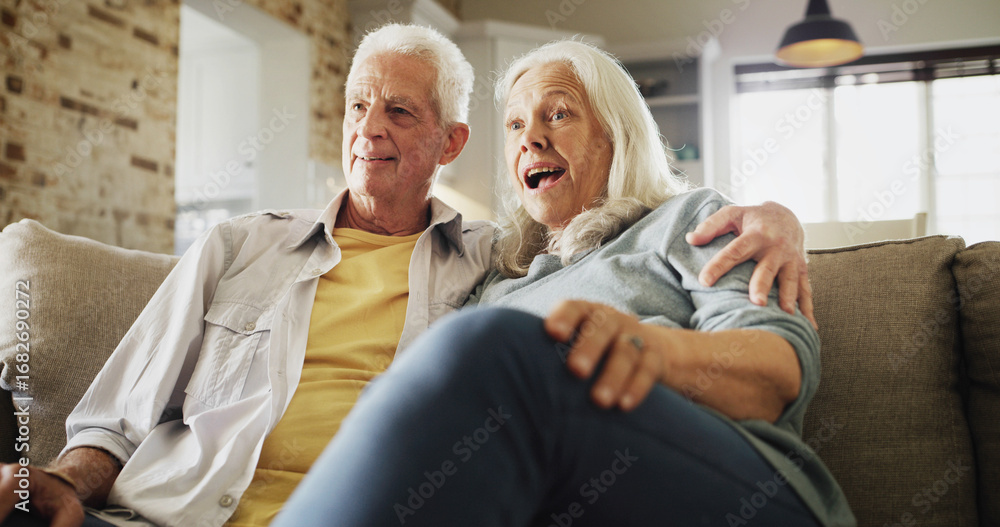 Obraz premium Senior couple, hug and watching tv with surprise on sofa for horror movie, bonding or scary series. Happy, elderly people and relax in house with thriller show, weekend break and retirement support
