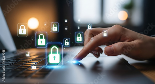Finger on laptop with digital padlocks hovering representing online security and data protection measures
