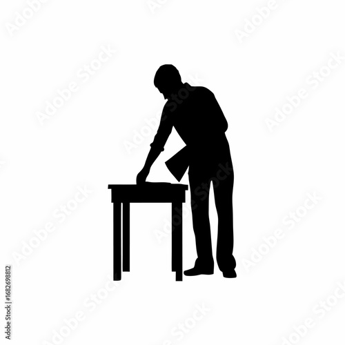 Silhouette of a person polishing a wooden table clean background