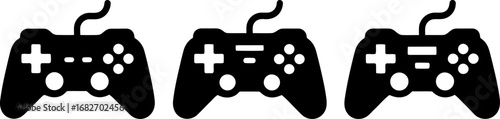 Three black video game controllers lined up on a white background, ready for multiplayer fun