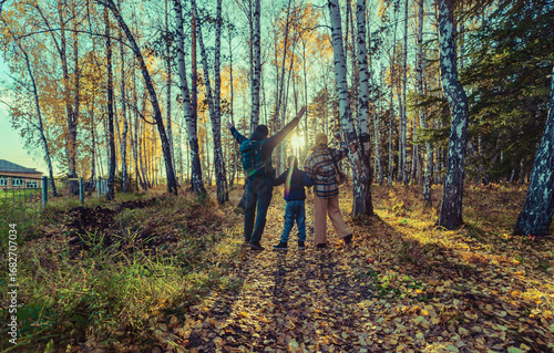 Bild auf Leinwand Family walk in autumn