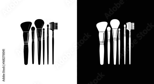 A set of professional makeup brushes, a black and white split icon for makeup artists, beauty salons, and cosmetic application.