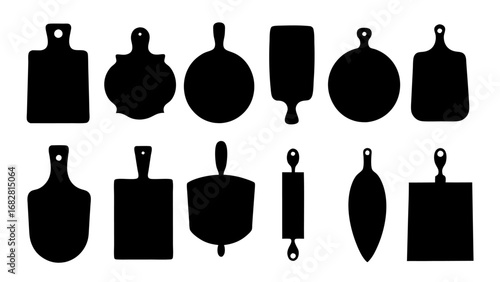 Vector graphic set of isolated black kitchen cutting board silhouettes with various shapes and rolling pin