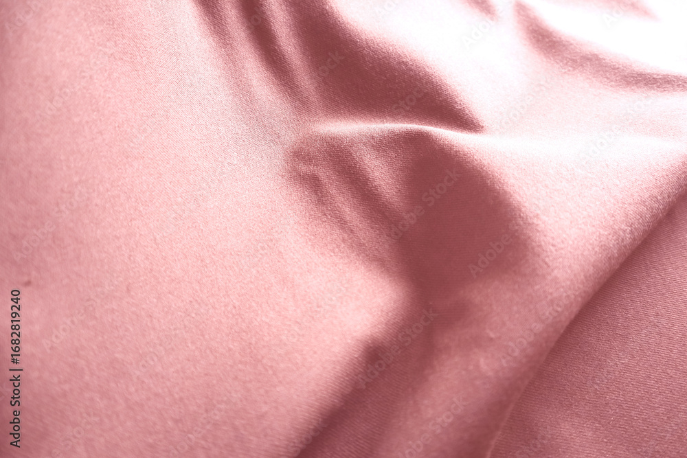Fototapeta premium Red silk fabric drapes, studio shot, elegant waves, background blur, textile design