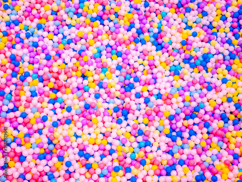 colorful ball pit with thousands of multicolored plastic balls at indoor playground entertainment center