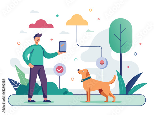 Man teaching dog fetch with smartphone and cloud technology in a park setting