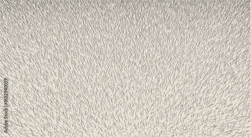 Close-up of a light beige, fluffy, textured surface resembling fur or fabric.