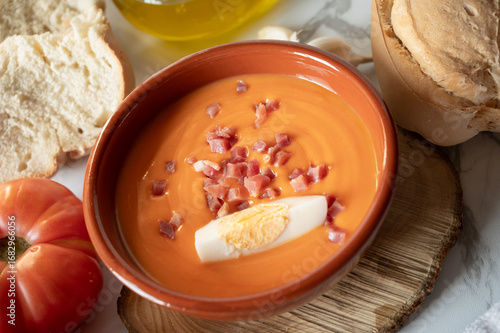 Fototapeta Naklejka Na Ścianę i Meble -  Spanish salmorejo with ham, egg, bread and tomato