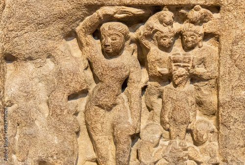 фотографія ruined stone relief illustrating buddhist teachings