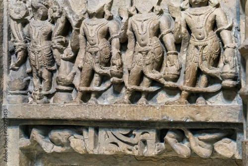 фотографія ruined stone relief illustrating buddhist teachings