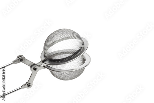 Slika na platnu Stainless steel tea infuser with handle, featuring a mesh design for brewing loo