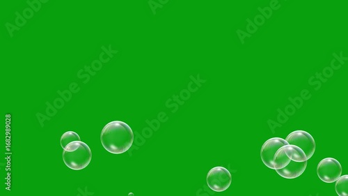 Floating soap bubbles on green screen background