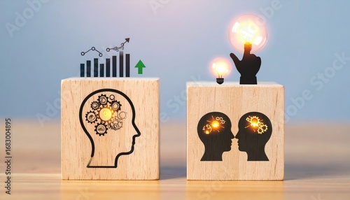 Two wooden blocks, one displaying a profit graph above a head with gears, the other shows heads with glowing bulbs