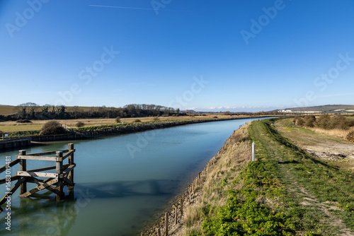 Wallpaper Mural A footpath running alongside the River Ouse between Lewes and Southease, on a sunny spring day Torontodigital.ca
