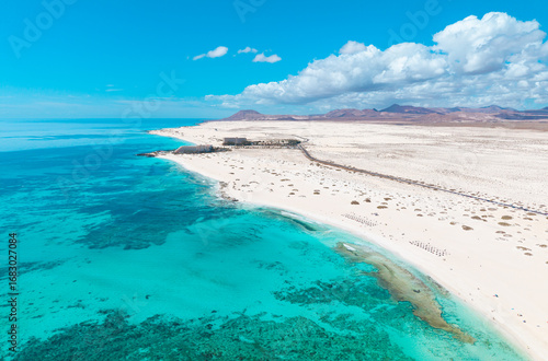 High quality aerial panoramic image of the beautiful Flag Beach, Grandes Playas with Lobos island in the background near Corralejo in Fuerteventura Spain