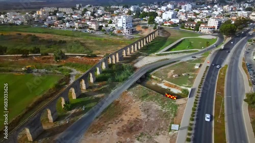 Aerial view of Larnaca, Cyprus. 
Morning traffic in the urban environment. Buildings, roads, cars and historical views.