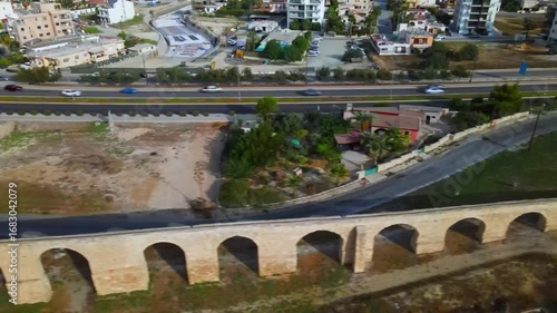 Aerial view of Larnaca, Cyprus. 
Morning traffic in the urban environment. Buildings, roads, cars and historical views.