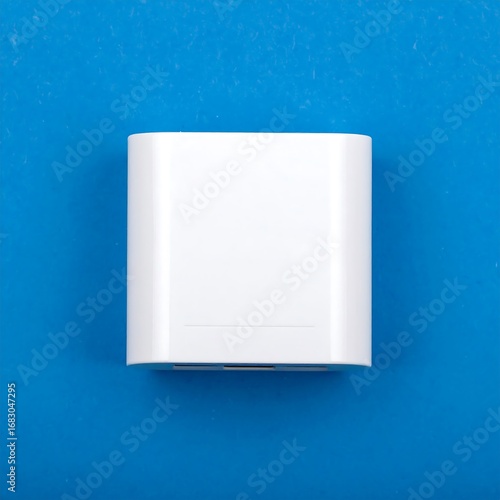 White rectangular adapter on blue background