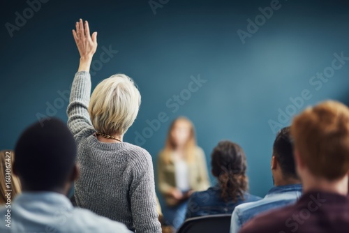 Student Raising Hand in Classroom for Discussion Participation.