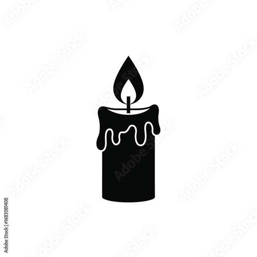 Black candle with dripping wax and flame burning