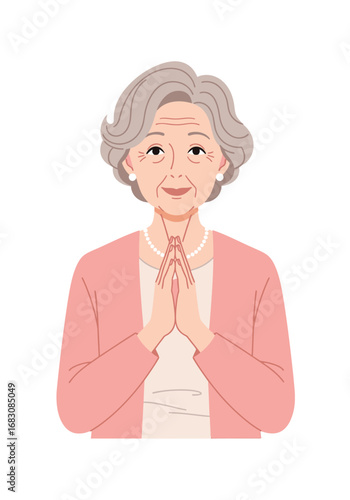 Senior woman in praying position, kind gesture